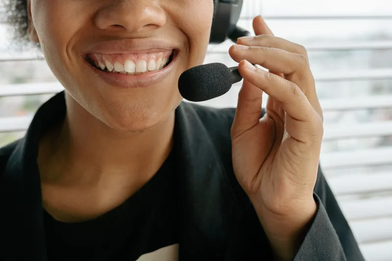 Customer support representative on a headset handling a buyer inquiry
