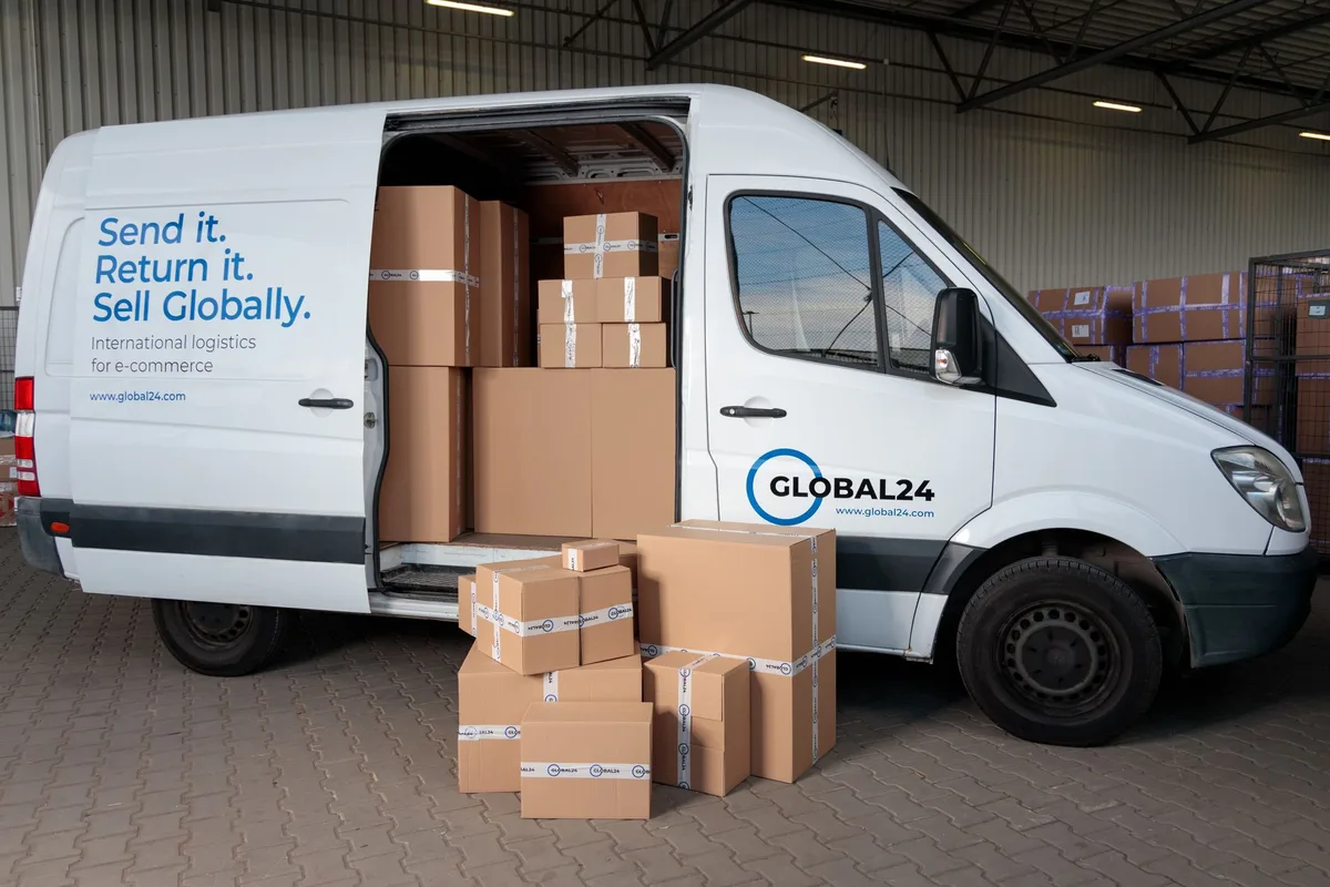 Warehouse worker loading a delivery van with cardboard boxes for outbound dropshipping order fulfillment