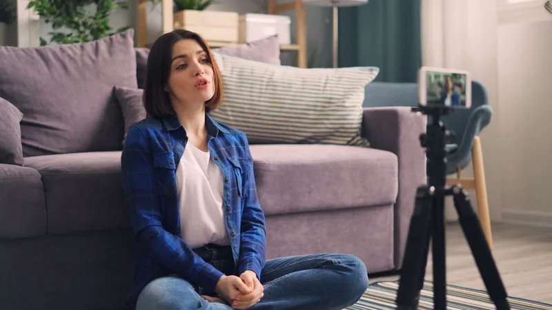 Content creator recording a product video on her smartphone as a potential affiliate partner