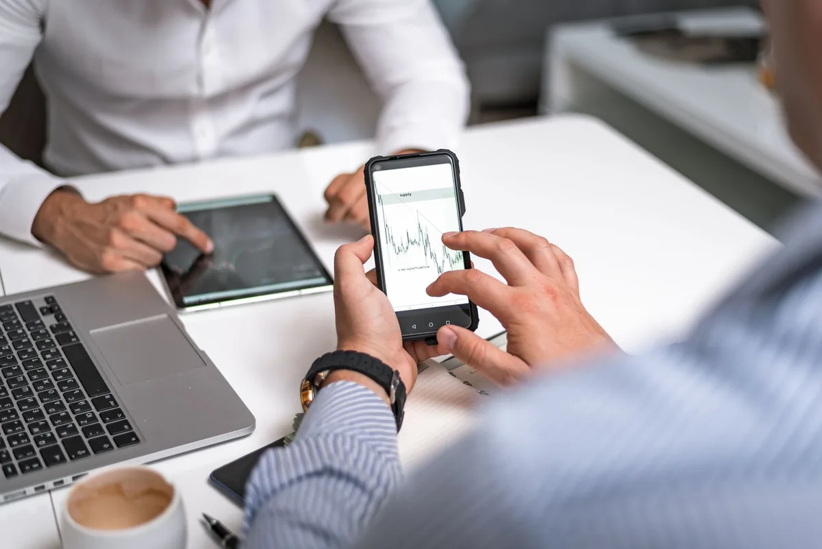 Vietnamese ecommerce seller reviewing TikTok Shop affiliate analytics dashboard on smartphone
